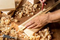 carpenter-working-on-a-piece-of-wood-with-pencil